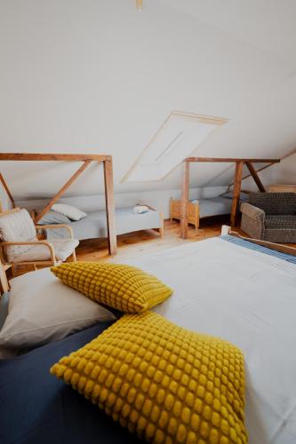 a room with a bed with corn cushions on it at Dandzenieki in Pāvilosta