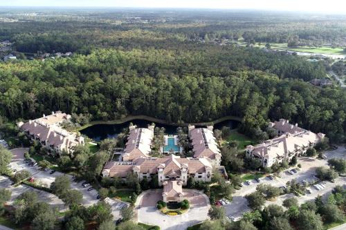 an aerial view of a mansion with trees at Studio with preserve view and balcony 4212-SP in Saint Augustine