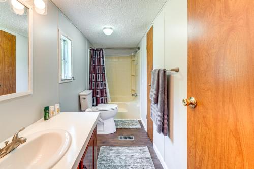 a bathroom with a tub and a toilet and a sink at Well and Cellar Near Kanawha River and ATV Trails! 
