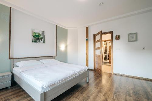Ένα ή περισσότερα κρεβάτια σε δωμάτιο στο Apartamenty Sali