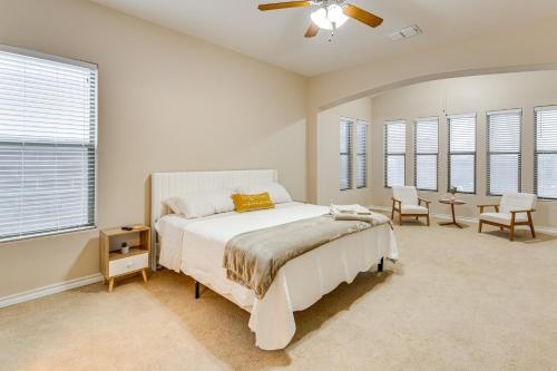 a bedroom with a bed and a ceiling fan at 7 Mi to Lake Casa Blanca Laredo Family Home! in Laredo