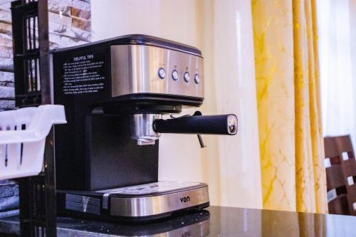 a coffee machine sitting on top of a counter at Wiga Nest Homes Narok in Narok