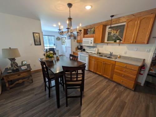 a kitchen with a table and chairs and a dining room at Maple Suites in Clearwater
