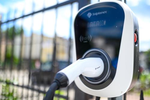 a close up of a phone attached to a parking meter at Moris Beach Hotel in Gdańsk