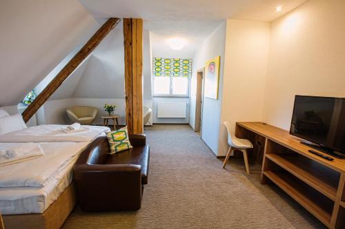 Postel nebo postele na pokoji v ubytování Hotel Na Šustně