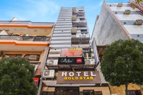 a hotel sign on the side of a building at Super Hotel O Hotel Gold Star in New Delhi