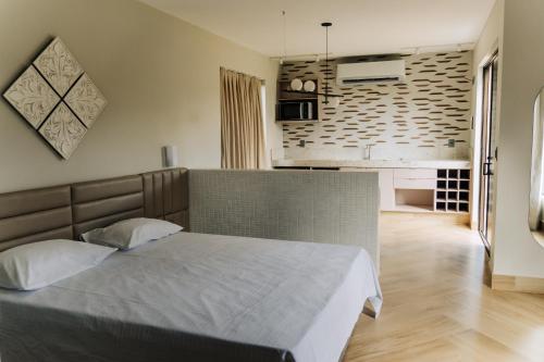 Кровать или кровати в номере TABULEIRO loft novo, moderno e espaçoso