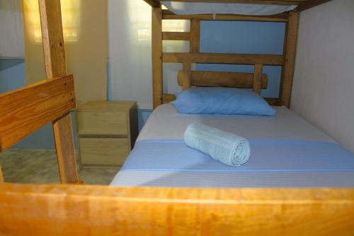 a roll of toilet paper sitting on top of a bunk bed at Casa Bambudas in Rincón