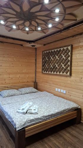 Postel nebo postele na pokoji v ubytování Voyage Tatariv