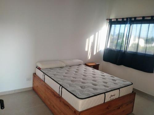 a bed in a room with a mattress at Complejo Marlu in Federación
