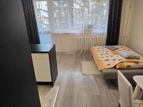 Ένα ή περισσότερα κρεβάτια σε δωμάτιο στο Słoneczna Wyspa 198