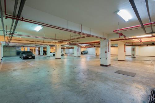 an empty parking garage with cars parked in it at Duo Romance Hotel in Hualien City