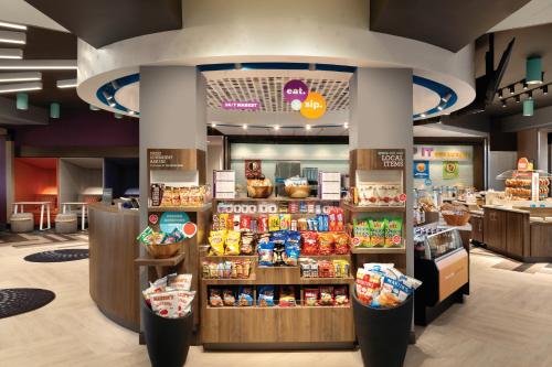 a grocery store with a display of food at Tru By Hilton Joliet Plainfield in Joliet