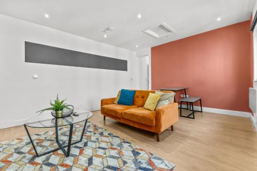 a living room with a couch and a table at Heart of the City Centre - Serviced Apartments in Manchester