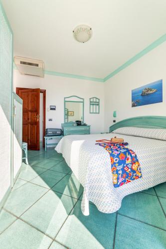 Кровать или кровати в номере Hotel Casa del Sole
