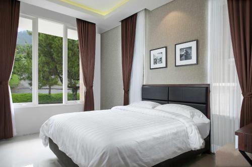 Ένα ή περισσότερα κρεβάτια σε δωμάτιο στο Azcarya Villa