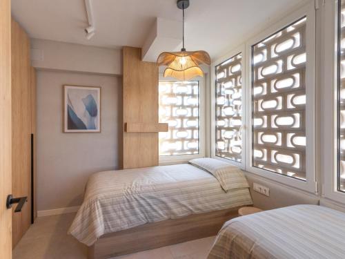 Ένα ή περισσότερα κρεβάτια σε δωμάτιο στο Una esquinita al mediterráneo