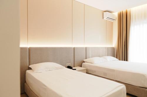 Postel nebo postele na pokoji v ubytování Hotel Mediterrane