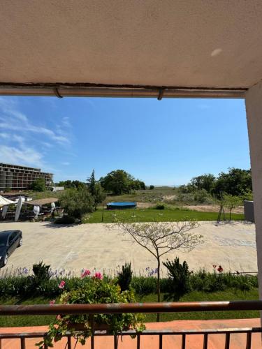 a view of a beach from a window at Hotel Surf Primorsko in Primorsko