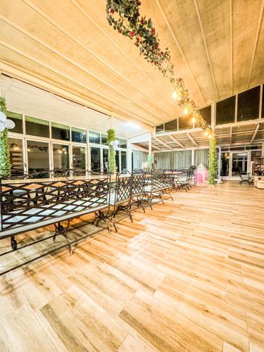 a banquet hall with tables and chairs in a building at Hotel Surf Primorsko in Primorsko