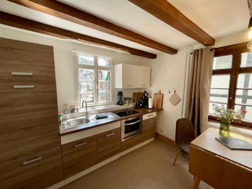 Кухня или мини-кухня в City Apartments Monschau
