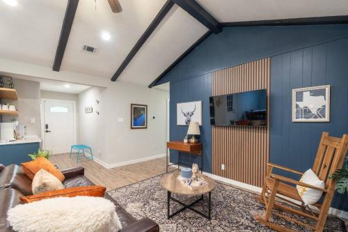a living room with a couch and a table at Congress Capitol by The Key Rentals in Austin