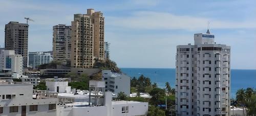 a view of a city with tall buildings at Mar & Sierra El Rodadero Apto Vista al Mar Piscina & Playa in Rodadero