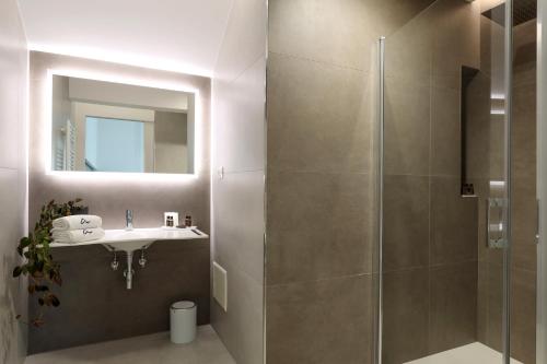 a bathroom with a shower and a sink at Daline Holiday Rooms in Acquarica del Capo