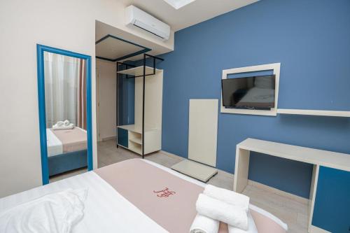 Llit o llits en una habitació de Laid Hotel