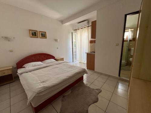 Postel nebo postele na pokoji v ubytování Apartments Kuljaca