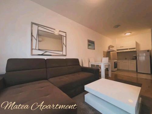 a living room with a couch and a table at Matea in Budva