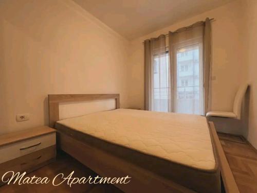 a bedroom with a bed and a window at Matea in Budva