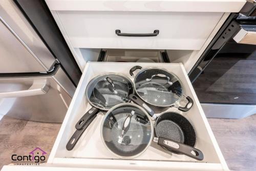 a drawer full of utensils in a kitchen at Rivers Edge, Mtn Views, AC, BBQ, King Bed in Golden