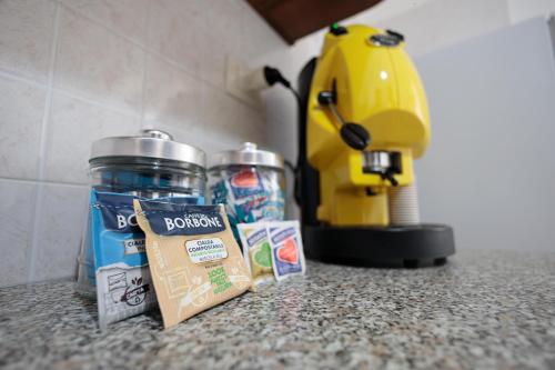 a kitchen counter with a counter top with a blender and food at Nonno Gigi in Leuca