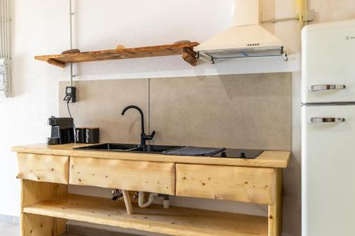 a kitchen counter with a sink and a stove at Aganta Klima Syrma in Klima