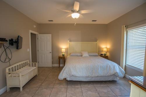 a bedroom with a bed and a ceiling fan at Heaven's Walk in Indian Pass
