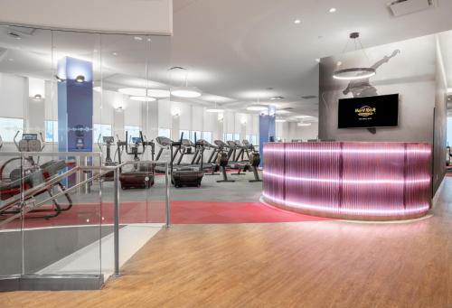 a gym with a pink bench and treadmills at Hard Rock Hotel & Casino Atlantic City in Atlantic City