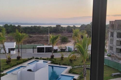 a view of a pool from a building at Paktinemi Diamante Fantastic View Beach Club in Acapulco