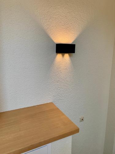 a kitchen with a light on the ceiling at Hotel Zum Pfalzgrafen in Heidelberg