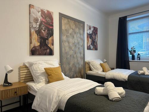 Postel nebo postele na pokoji v ubytování Apartments 23