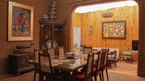 a dining room with a table and chairs at La Casita de Coyoacán in Mexico City
