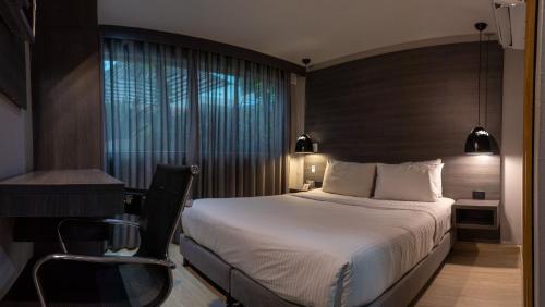 Una cama o camas en una habitación de Hotel Blue Concept