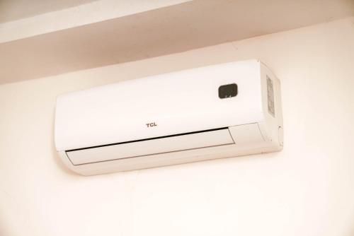a white router hanging on a wall at Élégant appartement F3 au centre in Kenitra