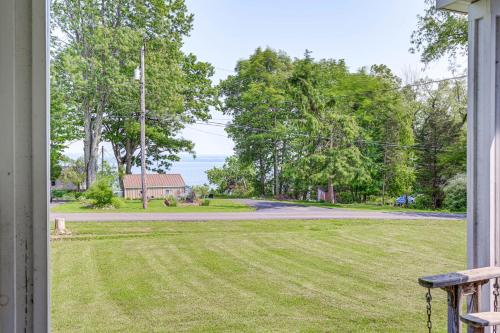 a view from the porch of a house with a yard at Peaceful Family Home Near Cayuga Lake State Park in Seneca Falls