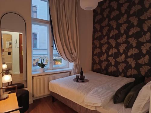 Ένα ή περισσότερα κρεβάτια σε δωμάτιο στο Kamienica Pod Aniołami Szeroka1