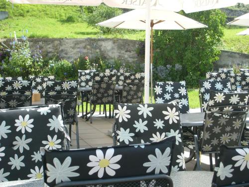 a bunch of chairs with white flowers on them at Hotel Danis in Lenzerheide
