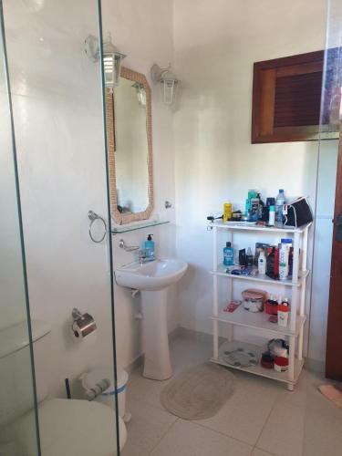 a bathroom with a sink and a toilet and a shower at SwissChalet Hp-Kite in Barra Grande