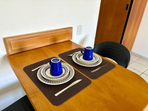 two blue cups and saucers on a table at MoviHosts Ayambra I Próximo ao Centro in Natal