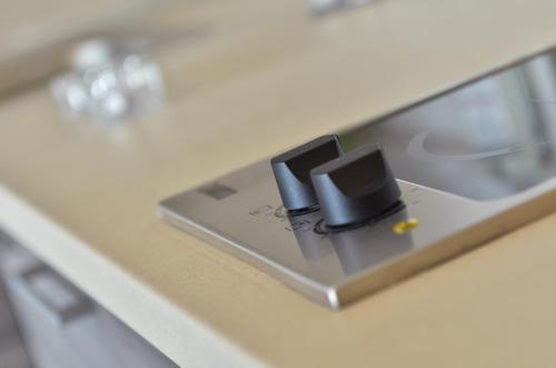 a close up of a counter top with a adapter at Apartmani Perić Meka Draga in Obrovac