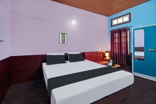 Postel nebo postele na pokoji v ubytování Hotel O Heritage Nest Resort Kazirnga